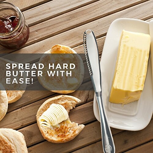 Butter spreader knife with ergonomic design on bread and butter.