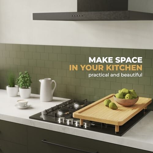 Modern kitchen counter with a wooden tray of green apples, herbs, and a white pitcher