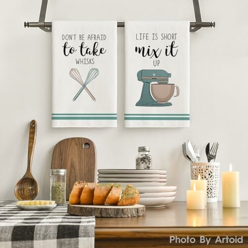 Kitchen towels with fun baking quotes and utensils.