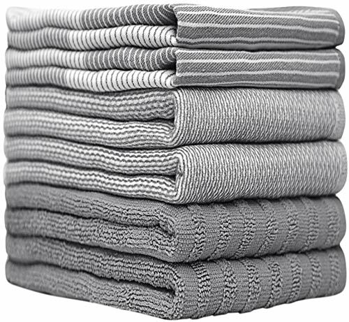 Stack of gray and striped towels folded neatly.