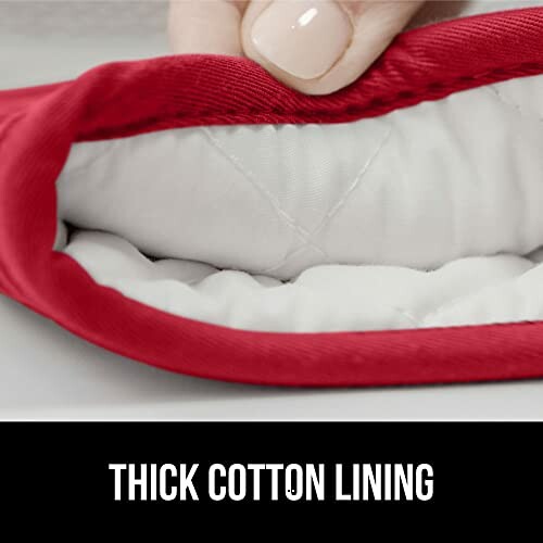 Close-up of a thick cotton lining with a red outer layer.